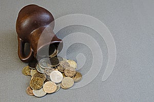 Ancient jug with coins. Old coins in a pot.