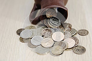 Ancient jug with coins. Old coins in a pot.