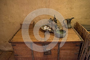 Ancient jug, plate, cups, sauser and teapot on the table