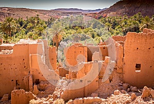 Ancient kasbah ruins and palm trees in Tinghir Morocco