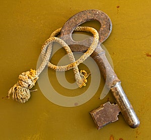 Ancient key on grunge metal background