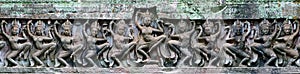 Ancient Khmer Laterite Stone Carving of Female Dancers photo