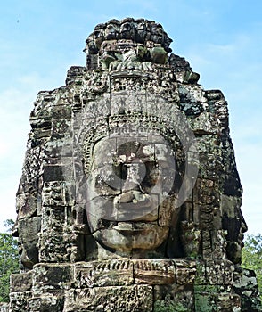 Ancient Khmer Stone Carving of Trimurti at Bayon photo