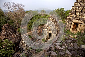 Ancient khmer temple view in Angkor Wat, Cambodia. Sunrise in Phnom Bakheng. Morning dew in Phnom Bakheng temple.