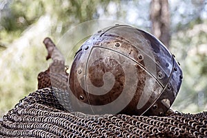 An ancient knightly helmet covered with rust