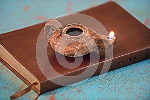 Ancient Lamp on Bible