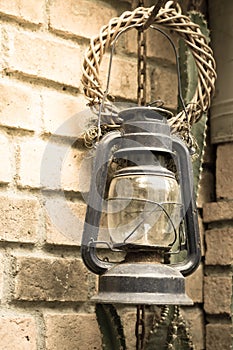 Ancient lamp with bricks wall.