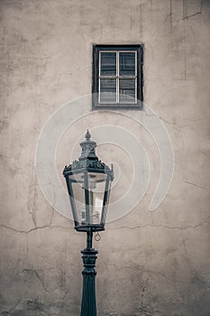 An ancient lamp and a window.