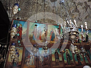 Ancient lamps and paintings in the Church of the Sepulchre of Saint Mary