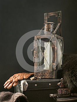 Ancient lantern. Old vintage metal railway lamp on black background