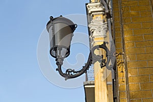 Ancient lantern on the wall of a building