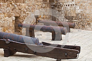 Ancient Larnaca castle walls and cannons in the courtyard, Cyprus