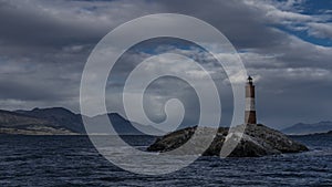 An ancient Les Eclaireurs Lighthouse is installed on a small rocky island in the Beagle Channel.