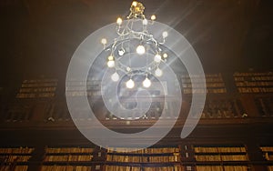 Ancient library and lamp inside Palazzo dei Priori in Fermo town, Marche region, Italy