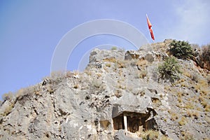 Ancient Licia tomb cut down in rock. Fethiye, Turkey photo