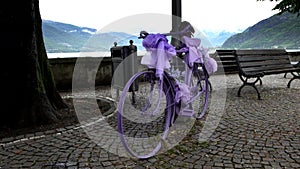 Ancient lilac colored bicycle on Lake Como