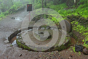 Ancient lime grinder used for the powdering of lime, Tikona fort, Pune