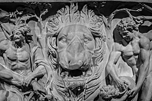 Ancient lion head relief on the wall. Mythology stone art bas-relief. Uvarov sarcophagus dating from 210 AD