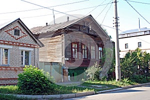 The ancient lordly inhabited wooden house on Karl Marx Street in the city of Syzran. Summer city landscape. Samara region.