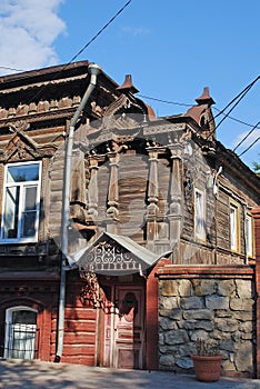 The ancient lordly inhabited wooden house on Karl Marx Street in the city of Syzran. Summer city landscape. Samara region.