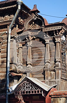 The ancient lordly inhabited wooden house on Karl Marx Street in the city of Syzran. Summer city landscape. Samara region.