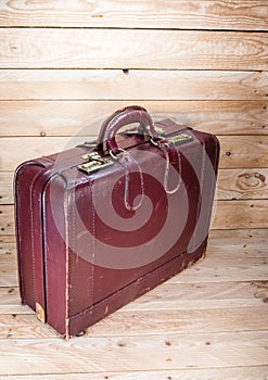 Ancient luggage on wood floor background is wood