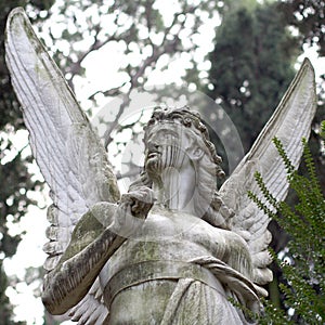Ancient marble Angel statue against sky