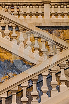 Ancient marble staircase, antique wall. Italy