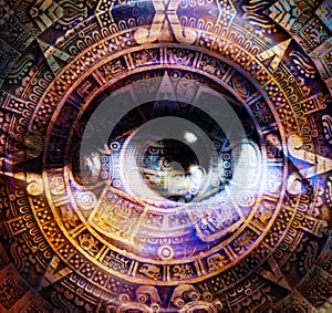 Ancient Mayan Calendar and woman eye, abstract color Background, computer collage. Eye in circle light.