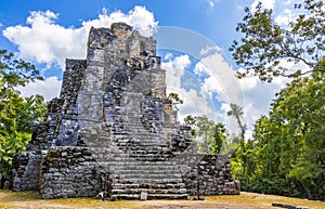 Ancient Mayan site with temple ruins pyramids artifacts Muyil Mexico
