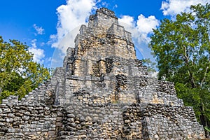 Ancient Mayan site with temple ruins pyramids artifacts Muyil Mexico