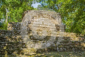 Ancient Mayan site with temple ruins pyramids artifacts Muyil Mexico