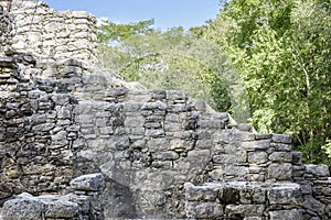 Ancient Mayan stone wall relics in Coba Ruins, Mexico