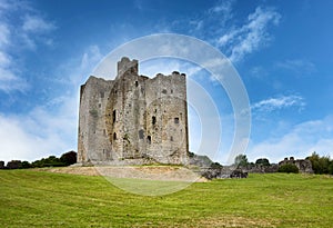 Ancient mediaeval castle in Ireland surrounded by grassy fields