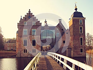 Ancient medieval stone fortress surrounded by water channel, castle Ruurlo, Netherlands, Europe