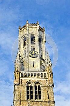 Ancient tower with clock in Bruge, Belgium photo