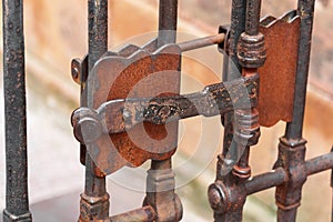 Ancient metal rusty wrought handle deadbolt latch of closed door