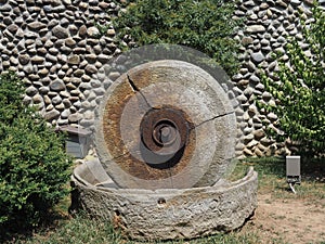Ancient mill millstone