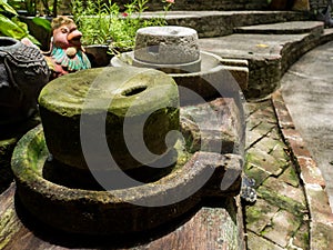 Ancient millstone have green lichen around and Ancient millstone