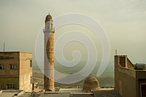 Ancient minaret in the city of Mardin overlooking