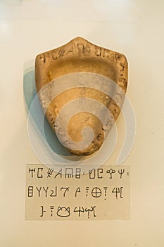 Ancient Minoan artifact with alphabet script at Heraklion archaeology museum, island of Crete