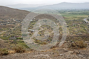 Ancient and modern cemetery of the Khor Virap monastery on a rainy August day.