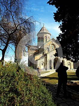 Ancient monastery of Bodbe in Georgia lit by the morning sun