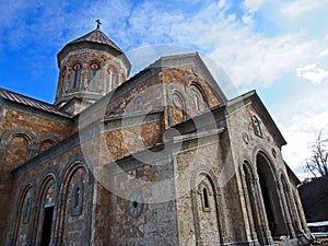 Ancient monastery of Bodbe in Georgia lit by the morning sun