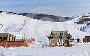 Ancient monastery buildings in a landscape of winter Mongolia