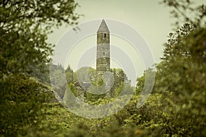 Ancient monastery in Glendalough, Wicklow Mountains of Ireland - travel photography. Stone monastic Church of Saint Kevin.