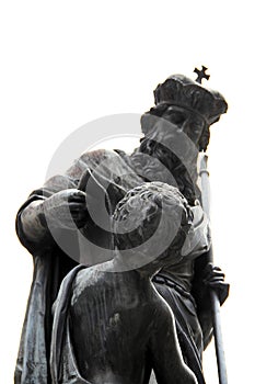 Ancient monument of the monarch and child made of black marble isolated on white