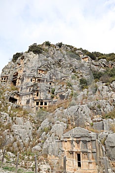 Ancient monumental lycian rock-cut tombs in archaeological site Myra near Demre, Turkey