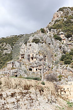 Ancient monumental lycian rock-cut tombs in archaeological site Myra near Demre, Turkey