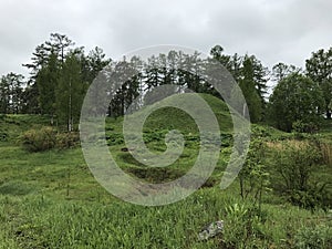 ancient mound old burial on the Luga river photo